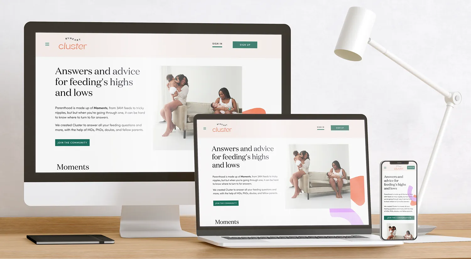 Desktop and laptop mockup of the Cluster homepage